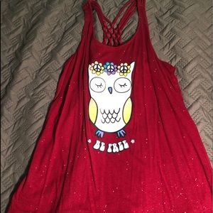 A red sparkly shirt with an owl on it